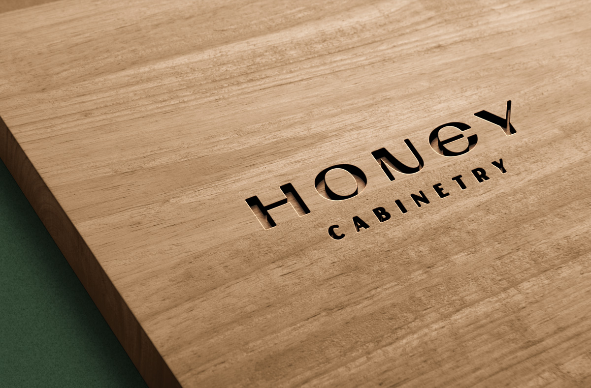 Honey Cabinetry wordmark applied to wood cabinetry